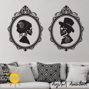 May include: Two black and white silhouette images of skeletons in ornate frames. The female skeleton is wearing a flower in her hair and the male skeleton is wearing a top hat. The images are on a white wall.
