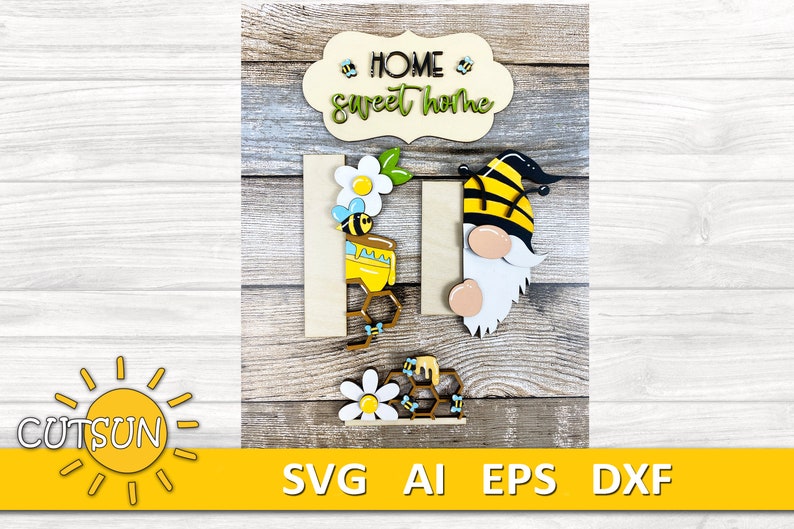 May include: Wooden sign with the text "Home Sweet Home" in a white banner with yellow flowers and bees. A gnome with a black and yellow bee hat and a beehive with a bee are also included.