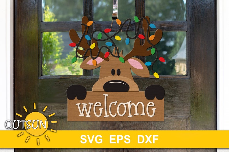 Reindeer head decorated with Christmas lights peeking behind a sign with the word Welcome. A digital download that can be used with Glowforge or other laser cutters. There is a version suitable for Cricut / Silhouette or other craft cutting machines.
