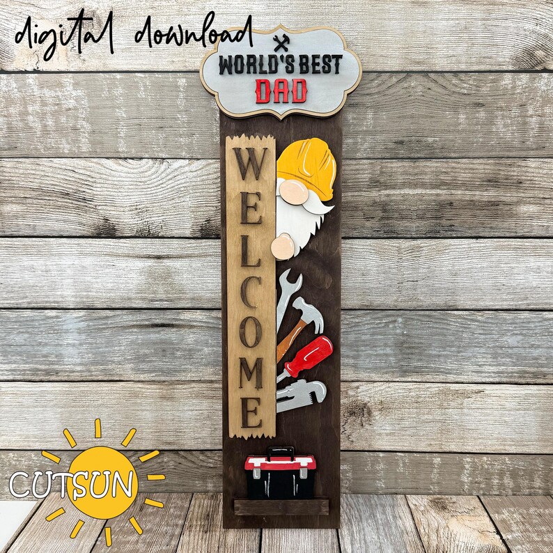 May include: A wooden welcome sign with the words "World's Best Dad" and "Welcome" on it. A cartoon gnome with a yellow hard hat is peeking out from behind the sign. The sign also has a toolbox and tools on it.