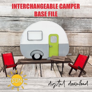 May include: A digital download file for a camper base, two chairs, and a table. The camper is white with a green door and gray trim. The chairs are red and the table is brown. The text "INTERCHANGEABLE CAMPER BASE FILE" and "digital download" is visible in the image.