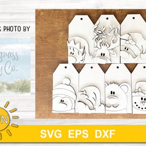 May include: Set of eight blank wooden Christmas gift tags featuring various winter holiday characters, including a snowman, penguin, reindeer, and bear. The tags are ready to be painted or decorated.