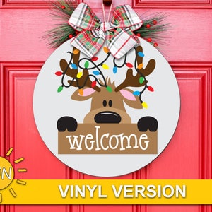 May include: A white round wooden door hanger featuring a reindeer with a string of Christmas lights and holding a sign that says "welcome".