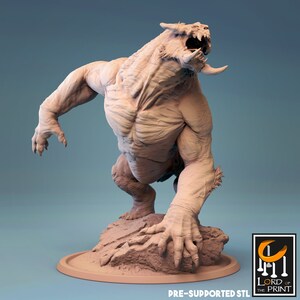 May include: A 3D printed miniature of a monstrous creature with sharp claws and teeth, standing on a rocky base. The creature is in a crouched position, with its head tilted back and its mouth open in a roar. The miniature is painted in a light brown color, and the base is painted in a dark brown color.