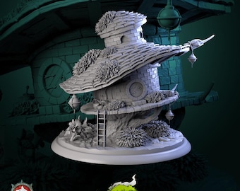 May include: A detailed, gray miniature tavern with a multi-tiered roof, small windows, and a ladder. The structure is surrounded by sculpted foliage and decorative hanging lanterns. The base features the text "Sprites, Slimes & Secrets" and "White Werewolf Tavern".