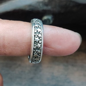 Handcrafted Silver oxidised band with mutiple little stars. Sterling silver ring resembles the sky in night with many little stars.
