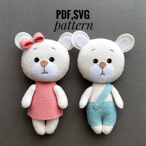 May include: PDF and SVG sewing patterns for two felt teddy bears. The girl bear is wearing a pink dress and a bow. The boy bear is wearing blue overalls.  PDF, SVG pattern.