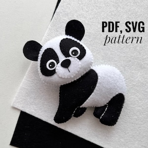 May include: A black and white felt panda bear toy with black eyes and a black nose. The toy is on a white surface with the text "PDF, SVG pattern" in black.