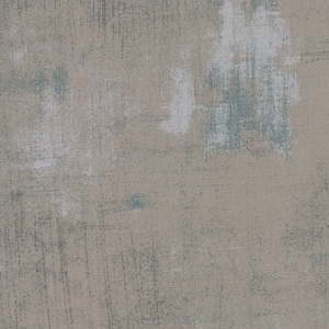 May include: Abstract background with a textured, beige canvas base. The canvas is painted with shades of grey and blue, creating a mottled, layered effect.