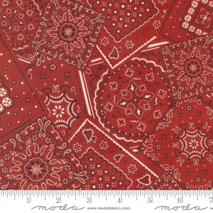 May include: Red fabric with a repeating pattern of white and black bandana designs. The fabric is a patchwork of different bandana patterns.