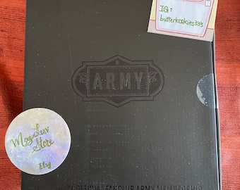 May include: A black rectangular box labeled Global Official Fanclub Army Membership with the word Army in a central emblem. A circular sticker reads Magic Luv Store Etsy, and a square sticker features a cartoon basket with IG butterkookies333.