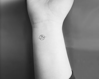 world tattoo on wrist