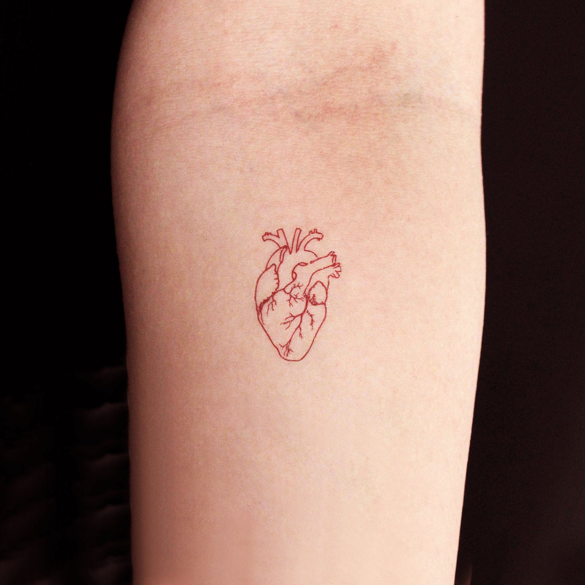 Red ink Tattoo on Dark Skin  Red ink tattoos, Mini tattoos, Simplistic  tattoos