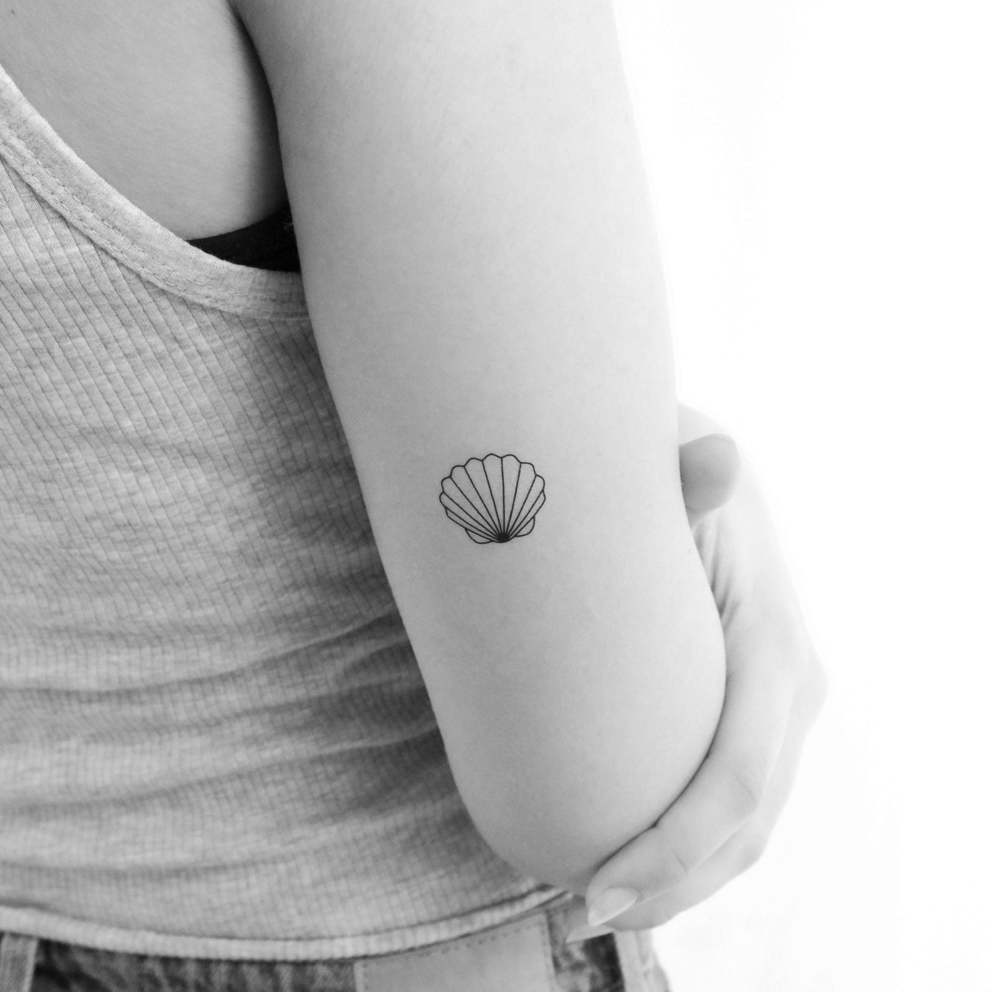 Fine Line Conch Shell Tattoo Design