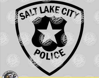 May include: A black and white graphic design featuring a shield-shaped emblem with the text SALT LAKE CITY POLICE and a central star. The image includes file format labels SVG, EPS, PNG, PDF and a circular logo with an eagle illustration.