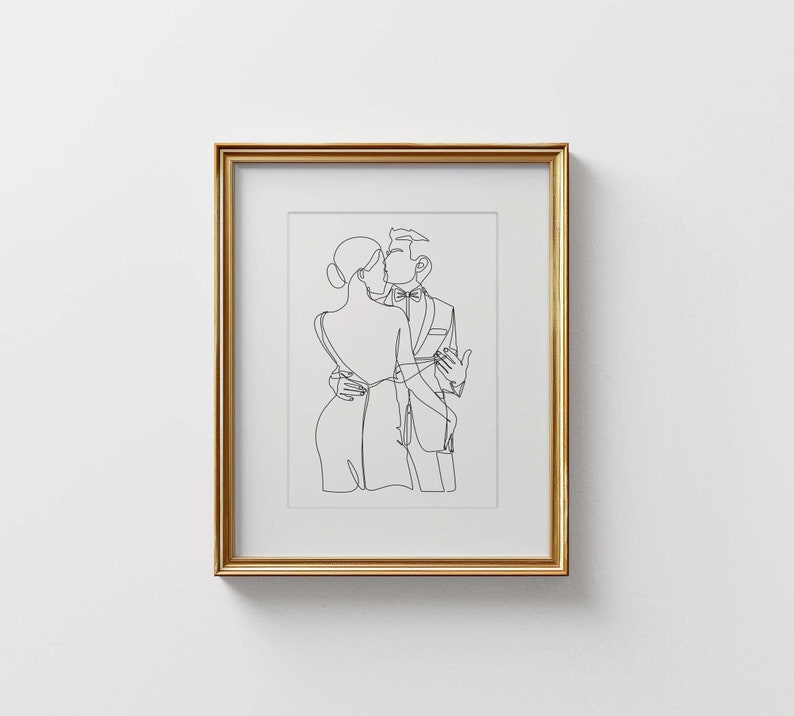 K&ouml;nnte beinhalten: Eine Schwarzwei&szlig;-Linienzeichnung eines tanzenden Paares, gerahmt in einem goldenen Rahmen.