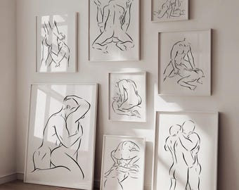 May include: A collection of framed black and white line art prints depicting human figures in various poses. The artwork is minimalist, with a focus on form and gesture. The prints are displayed on a white wall, creating a gallery-like aesthetic.