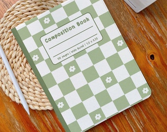 May include: A green and white composition book with a chequered pattern and white flowers. The book has the text "Composition Book" and "110 pages | Wide Ruled | 7.5 x 9.25" printed on the front cover.
