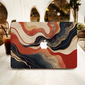 May include: A laptop skin featuring a wavy, abstract pattern in shades of terracotta, cream, navy blue, and black. The design includes intricate, fine-line textures and organic, flowing curves that surround the central white Apple logo.