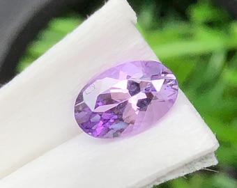 Faceted Oval Tanzanite Gemstone: Pink Purple Zoisite, 0.50 Carats
