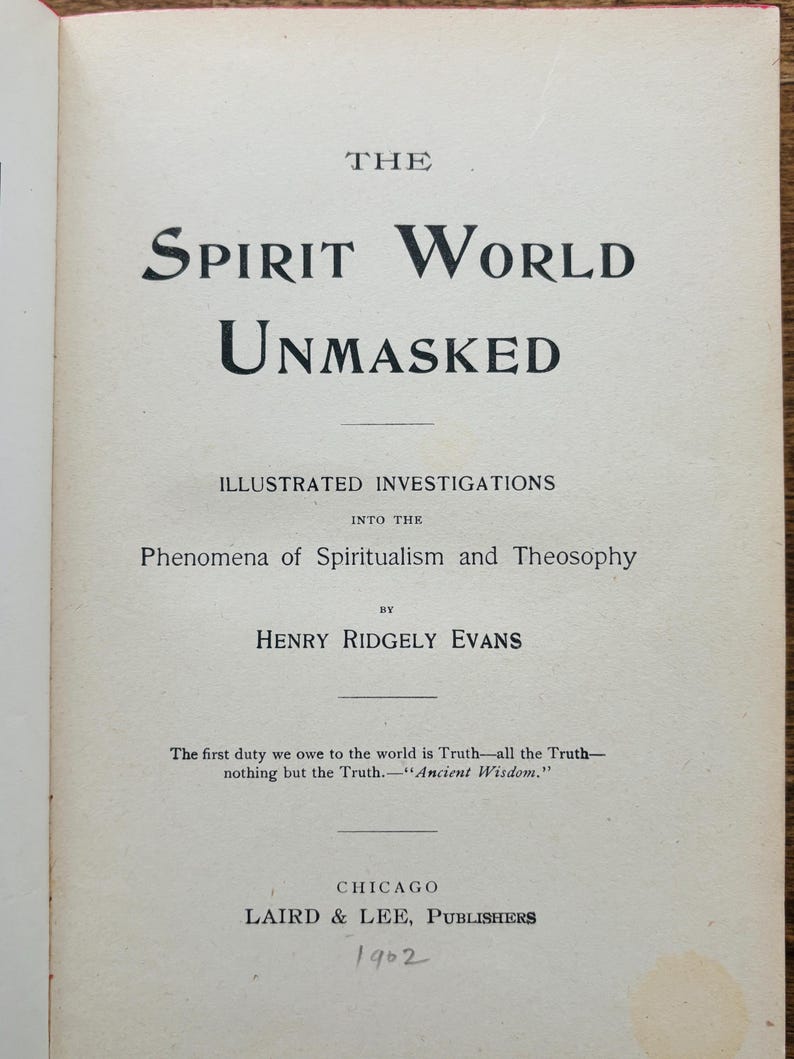 May include: An open book page featuring the title "The Spirit World Unmasked" in a large, bold, black font. The subtitle reads "Illustrated Investigations into the Phenomena of Spiritualism and Theosophy." The author is Henry Ridgely Evans. Published in Chicago in 1902.