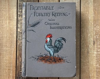 May include: Antique book titled "Profitable Poultry Keeping" with original illustrations. The cover is gray with embossed text and a detailed illustration of a rooster with a red comb and blue feathers. The book is set against a wooden background.