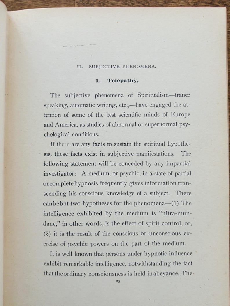 May include: A page from an old book, featuring printed text discussing 'Telepathy' and related topics like spiritualism and hypnosis. The text is set in a classic font, with the page showing signs of age.