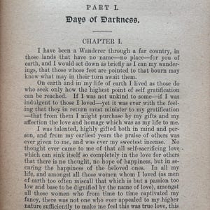 May include: An open book page with text from "Days of Darkness" is displayed. The text is in black font on a beige background. The title "Days of Darkness" is at the top, followed by Chapter I. The text is in a serif font.
