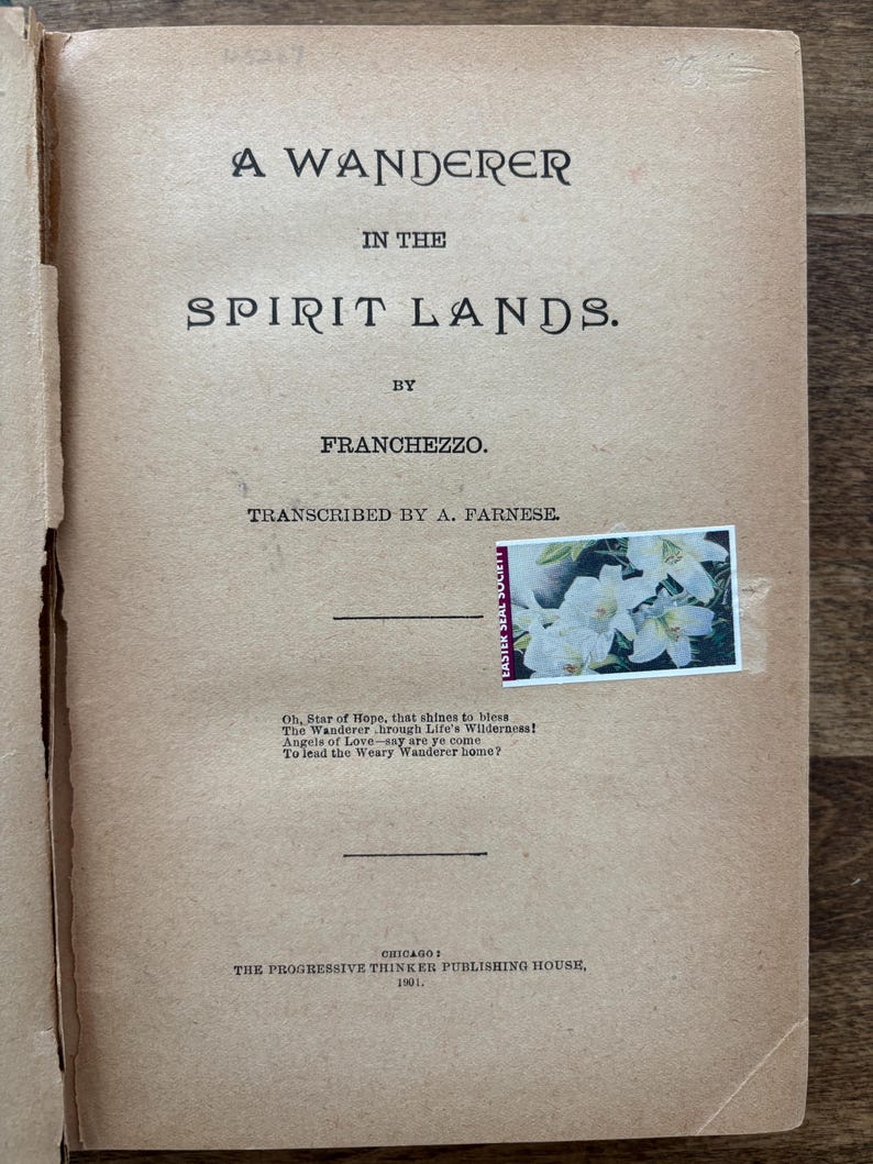 May include: Open book with the title "A Wanderer in the Spirit Lands" by Franchezzo. The cover is a light brown color with black text. A stamp with white flowers is affixed to the page. Published in Chicago in 1901.