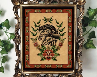 May include: A framed print of a traditional tattoo design featuring three black horses' heads with a red rose and green leaves in a wreath. The background is a light brown with a red and yellow border.