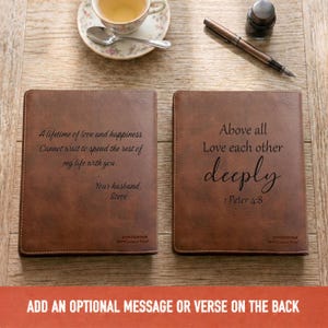 May include: Two brown faux leather book covers featuring engraved text. The left cover reads A lifetime of love and happiness, Cannot wait to spend the rest of my life with you, Your husband, Steve. The right cover reads Above all Love each other deeply, 1 Peter 4:8.