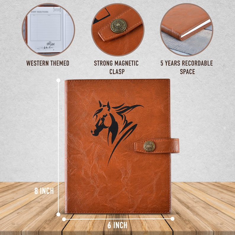 May include: A brown leather journal with a horse head design. The journal is 8 inches tall and 6 inches wide. It features a strong magnetic clasp and has space for 5 years of records. The journal is western themed.