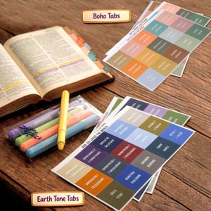 May include: A set of Bible index tabs in boho and earth tone color palettes, featuring printed book names. The collection includes an open Bible with applied tabs, a clear plastic case containing five pastel highlighters, and two sheets of stickers.