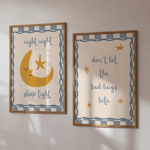 May include: Two framed wall art prints. One features a yellow crescent moon and star with the text "night night sleep tight". The other says "don't let the bed bugs bite" with star illustrations. Both have a blue and white checkered border.
