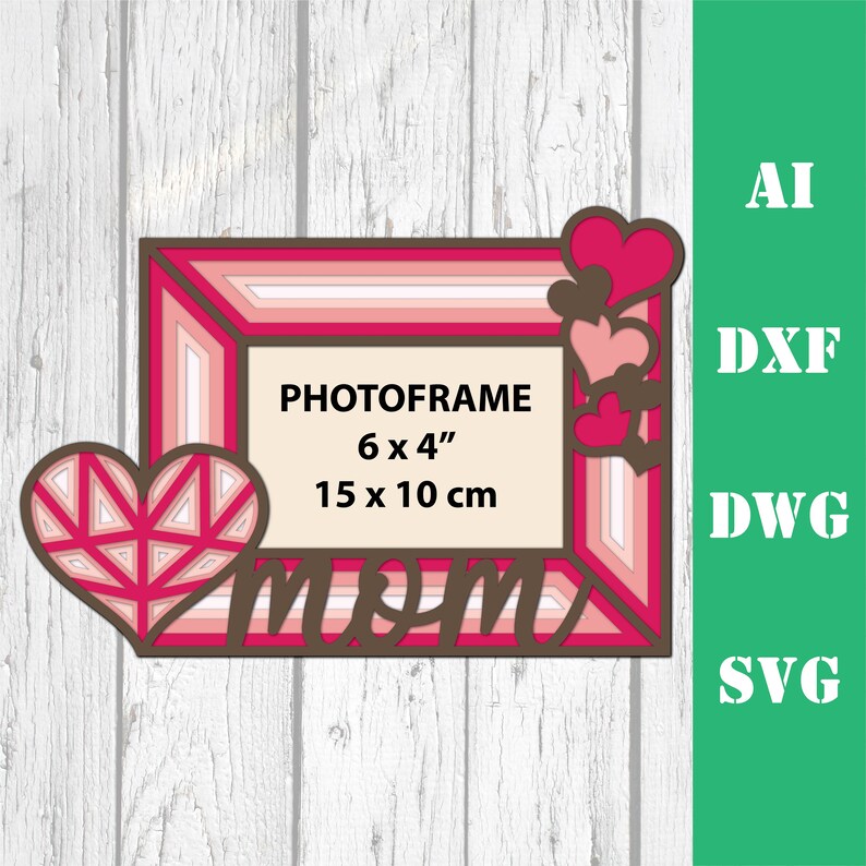 May include: A pink and brown layered photo frame with a heart design and the word "mom" in a decorative font. The frame is 6 inches by 4 inches or 15 centimeters by 10 centimeters.