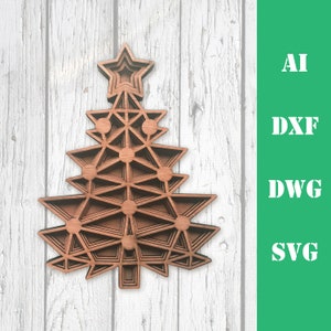 May include: A layered wooden Christmas tree ornament with a star on top. The ornament is brown with geometric cutouts and is displayed against a white and gray wood background. The text "AI, DXF, DWG, SVG" is on the right.