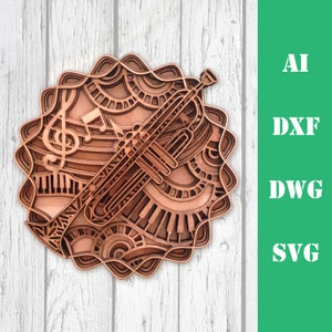 以下が含まれることがあります： トランペット、音楽記号、ピアノの鍵盤のデザインが施された、茶色の木製の切り抜き。デザインは複雑で、細部までこだわっており、マンダラのようなパターンになっています。