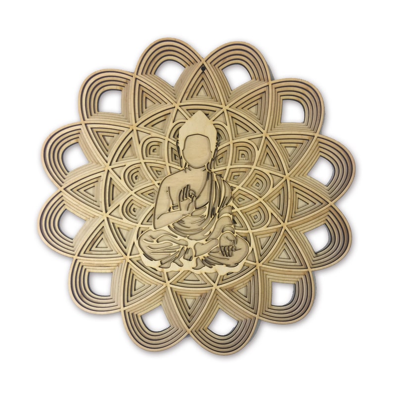 May include: A wooden wall art piece featuring a detailed mandala design with a cutout of a meditating Buddha figure in the center. The mandala is made of multiple layers of wood, creating a 3D effect.