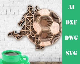 May include: A wooden laser cut design of a soccer player kicking a soccer ball. The design is layered and intricate, with the soccer ball appearing three-dimensional.
