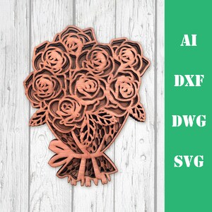 May include: A wooden cutout of a bouquet of roses with a brown ribbon. The roses are intricately designed with multiple layers.