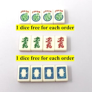 May include: A collection of Mahjong tiles with various designs. The top row features "JOKER" tiles with a green dragon design. The middle row shows green and red dragon tiles. The bottom row displays blue and white patterned tiles.