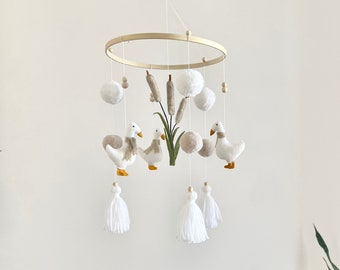 Unisex baby mobile with white geese and reeds