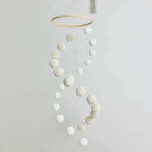 Infinity spiral baby mobile with pompoms neutral unisex color