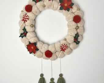 Red and green Christmas wreath with pompoms