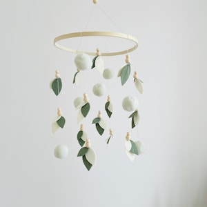 Neutral unisex baby mobile with leaves and green wooden balls