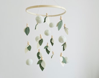 Neutral unisex baby mobile with leaves and green wooden balls