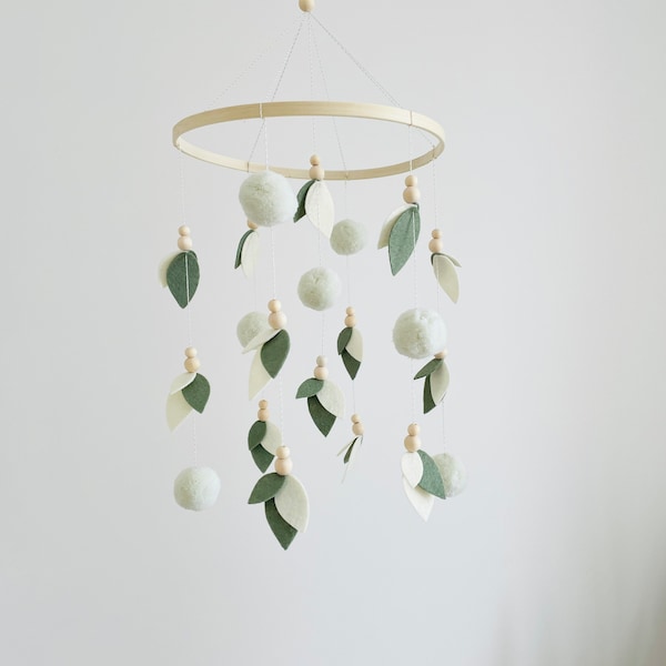 Neutral unisex baby mobile with leaves and green wooden balls