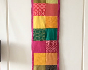 Handmade colourful wall hanging made with Indian faux silk, sari fabric and metallic thread, Indian table runner