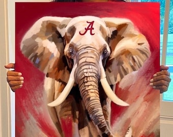 May include: A painting of a white elephant with a red "A" on its forehead, running towards the viewer. The background is red with a white and brown splatter effect. The text "Roll Tide!" is written in cursive at the bottom of the painting.