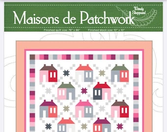 May include: A quilt pattern featuring a white background with a repeating pattern of colorful houses and stars. The quilt is surrounded by a pink and gray border. The title "Maisons de Patchwork" is at the top of the image. The finished quilt size is 76 inches by 86 inches and the finished block size is 10 inches by 10 inches.